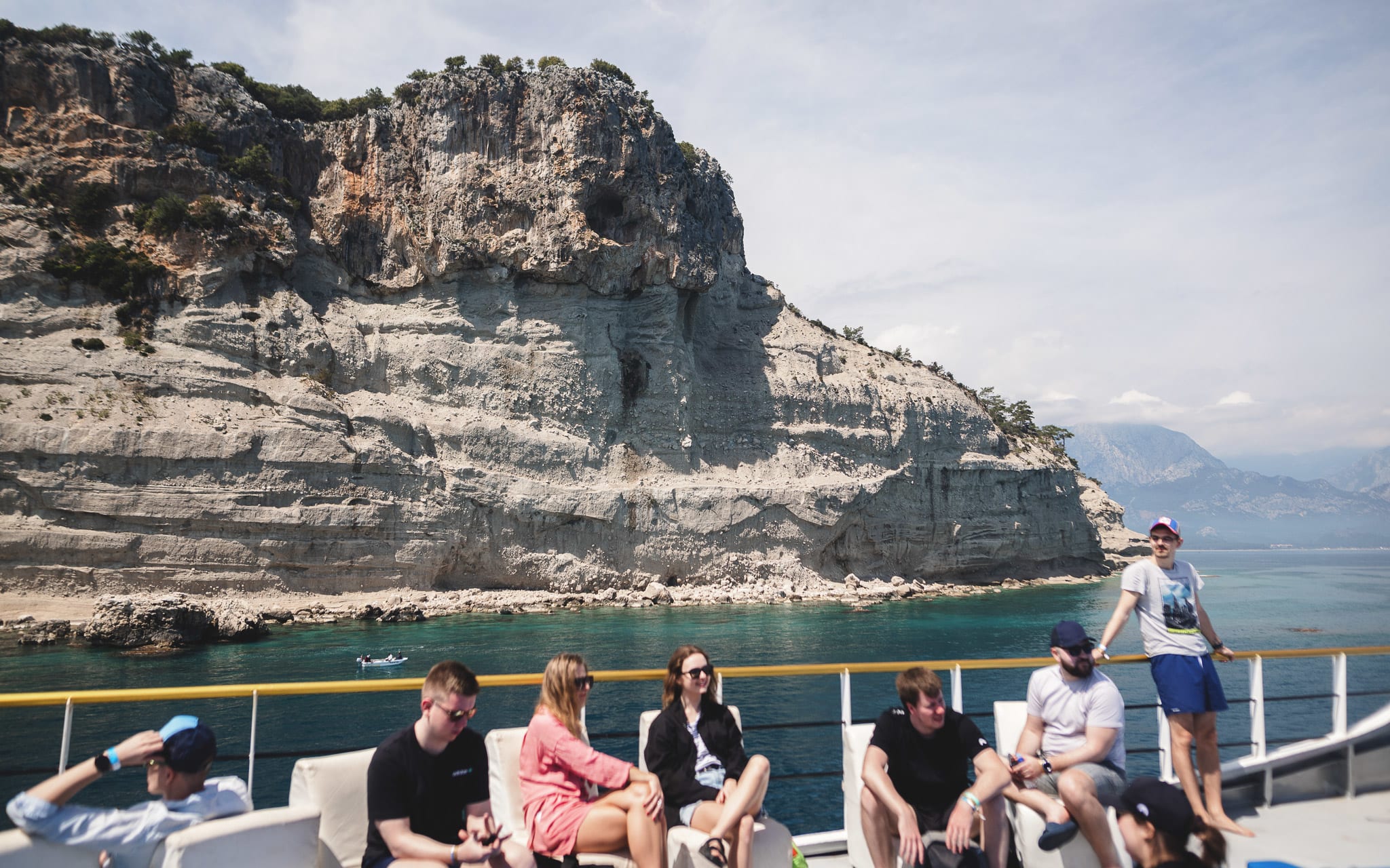 A group of people sailing with a boat